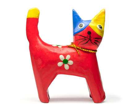 Multi-colored toy in the form of a cat with colors and a tapeの写真素材