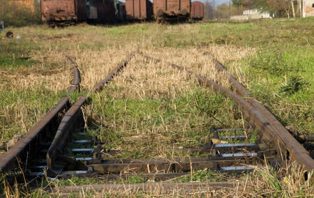 Old switches at the railway station. In the old station wagons are waiting on cassation.の写真素材