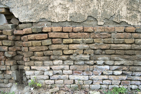 The old dilapidated wall of the house that is dilapidated.の写真素材