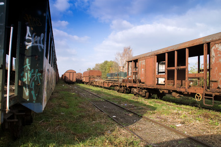 Old railway wagons on siding and waiting to cassation or repair.の写真素材