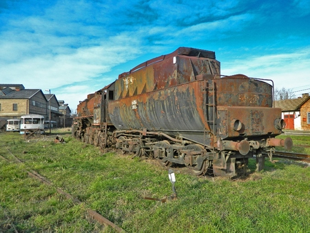 Large, old steam locomotive, which for years waiting for repair and Museum.の写真素材