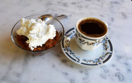 Black coffee and dessert apple with cinnamon and whipped cream foam.