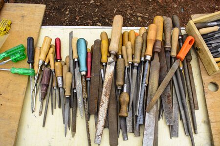 A variety of old files and screwdrivers exposed to the local flea market.の写真素材