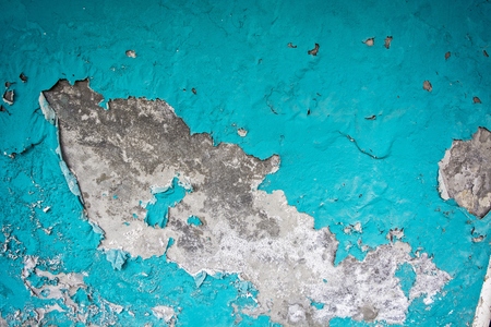 Old house wall with damaged paint.の写真素材