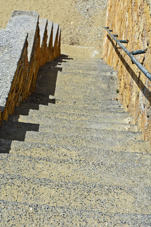 Old stairs in the littoral town where you can see the effect of salt in the air.の写真素材