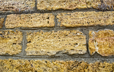 Home cracked old dilapidated brick wall.の写真素材