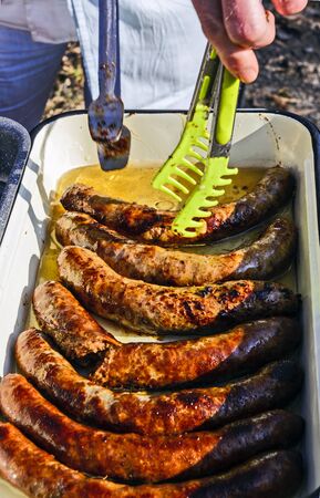 Fresh baked homemade sausages lure buyers.の写真素材