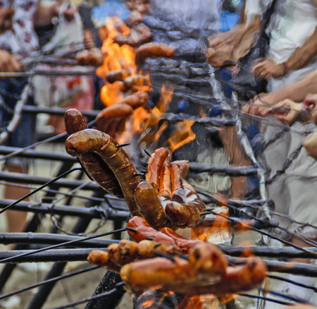 Traditionally street roast sausages on fire during the celebrations.の写真素材