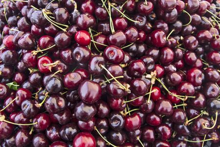 The market and fresh cherries in the market are waiting for customers.の写真素材