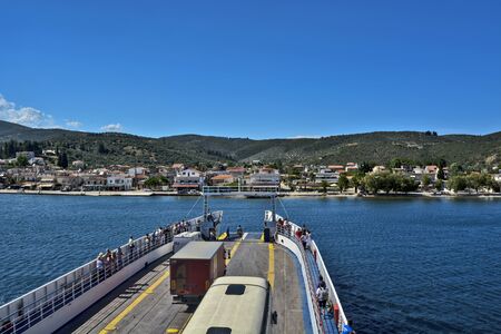 Port of Glifa, Greece, Jun 06, 2016. Arrival of ferry with a group of tourists to the dock at the port of Glifa. Tourists return from a vacation on Evia Island.のeditorial素材