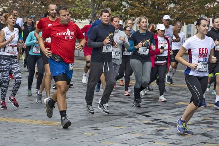 Zrenjanin, Serbia, October 06. 2019.A large group of competitors starts from the starting line at the 4 Zrenjanin Half Marathon streets of the city.のeditorial素材