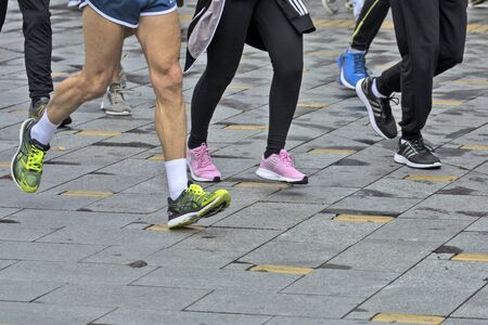 Zrenjanin, Serbia, October 06. 2019. A group of various competitors are racing through the streets of the city after the start of the race.のeditorial素材