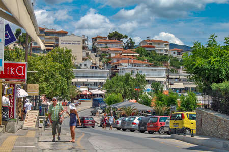 Neos Marmaras, Greece, Jun 08, 2013. Beautiful and quiet city street with countless small shops, restaurants and other facilities that are in the same. This is a typical Greek street in coastal cities.のeditorial素材