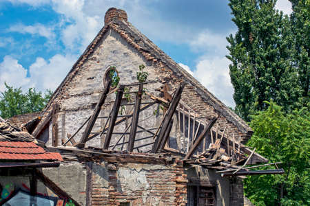 Zrenjanin, Serbia, July 04, 2020. The roof of an old building collapsed. Building awaiting repair or demolition?のeditorial素材