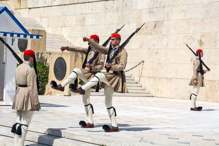 Athens, Greece, June 04, 2016. Evzoneses (presidential guards) are watching over the monument to the Unknown Soldier in front of the Greek Parliament building in Syntagma Square. The ceremony of changing the guard in front of the parliament.のeditorial素材