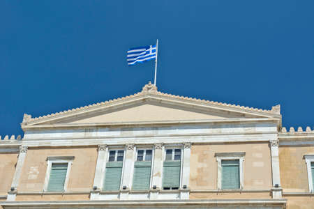 Athens, Greece, June 04, 2016. Greek national flag on top of the Greek parliament building.のeditorial素材