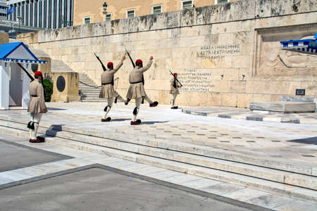 Athens, Greece, June 4, 2016. Euzons (presidential guards) are watching over the monument to the Unknown Soldier in front of the Greek Parliament building in Syntagma Square. Change of guard.のeditorial素材