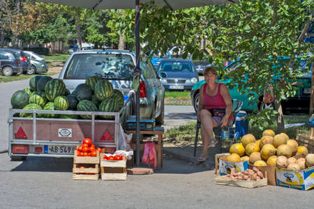 Zrenjanin, Serbia,July 29,2020.Efficient and fast sale of watermelons on the street near buildings with a lot of inhabitants.In addition to watermelons, some other agricultural products are also sold.のeditorial素材