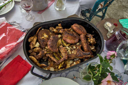 Nice and tasty baked meat in the roaster is waiting for the guests who should show up.の写真素材