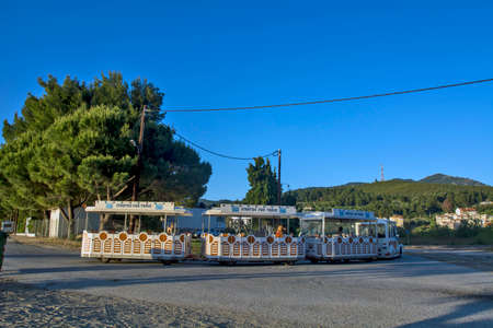 Neos Marmaras, Greece, May 29, 2019. Attraction for tourists and children passing a tourist street train in Greece. Train was an ideal means of going from the beach to another beach.のeditorial素材