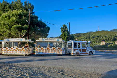 Neos Marmaras, Greece, May 29, 2019. Attraction for tourists and children passing a tourist street train in Greece. Train was an ideal means of going from the beach to another beach.のeditorial素材