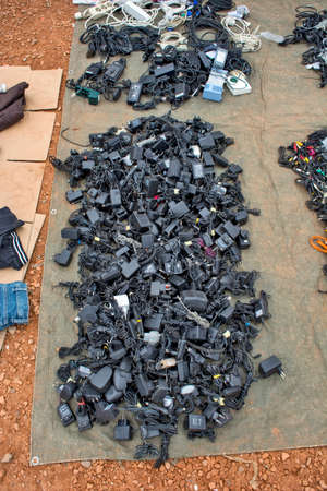 Zrenjanin, Serbia, November 10, 2015. A bunch of chargers for various mobile phones on the market where old and used goods and devices are sold. This market is always well visited.のeditorial素材
