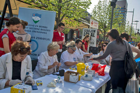 Zrenjanin, Serbia, April 12, 2018. Preventive action of medical control organized on the streets. Citizens on the street have their blood sugar levels and blood pressure controlled.のeditorial素材