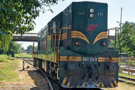 Zrenjanin, Serbia, August 31, 2020. Diesel locomotive 661 - 243, which mainly hauls freight trains, goes by train to the neighboring station.のeditorial素材