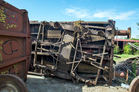 Zrenjanin, Serbia, August 31, 2020. Cutting of old railway wagons on the plateau of the station. The cut parts are transported to the ironworks for recycling. Cutting is done with a special machine.のeditorial素材