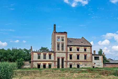 Zrenjanin, Serbia, July 04, 2020. Old abandoned factory that was completely destroyed. The factory was abandoned and the building was in a state of disrepair.のeditorial素材