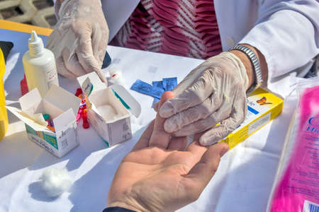 Zrenjanin, Serbia, September 28, 2019. Preventive action of medical control organized on the streets. Citizens on the street have their blood sugar levels and blood pressure controlled.のeditorial素材