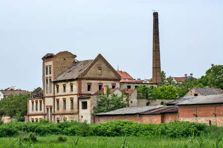 Zrenjanin, Serbia, May 15, 2020. Old abandoned factory that was completely destroyed. The factory is abandoned and the building is prone to collapse and collapse.のeditorial素材
