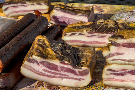 Exposed bacon and dried meat products. The products are domestic and are presented for sale.の写真素材