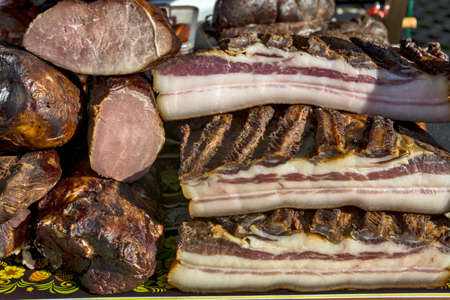 Exposed bacon and dried meat products. The products are domestic and are presented for sale.の写真素材