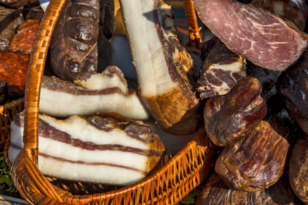 Exposed bacon and dried meat products. The products are domestic and are presented for sale.の写真素材