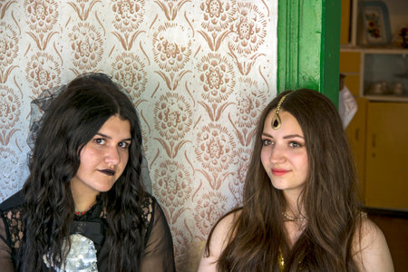Jasa Tomic, Serbia, June 12, 2022. Young girls voluntarily pose in an old house during a traditional photo shoot for a photo safari.のeditorial素材