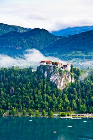 Bled castle between the lake Bled and the south Alps mountainsの写真素材