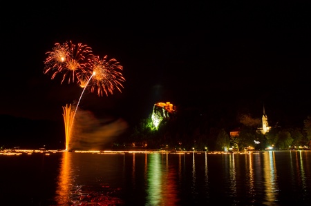 Annual midnight fireworks at lake Bled in orange color のeditorial素材