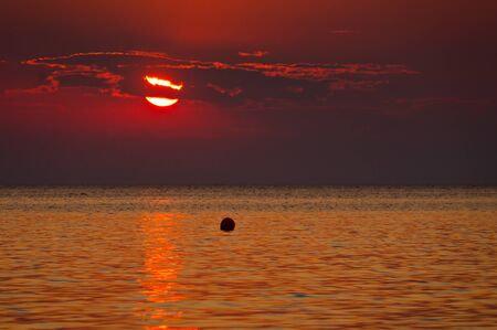 Fishing buoy at sunset - peninsula Sithoniaの写真素材