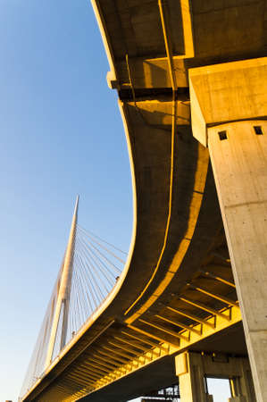 One summer evening below the suspension bridge over Sava riverの写真素材