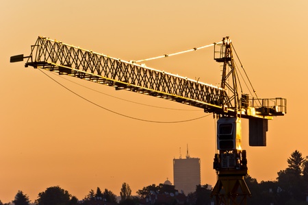 Big construction crane on the afternoon sunの写真素材