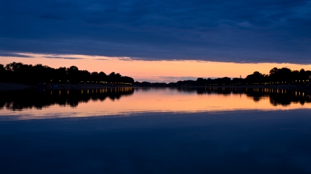 Evening clouds and its reflection in a lake Ada,  Belgrade, Serbiaの写真素材
