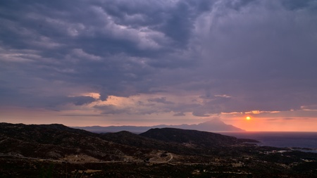 Stormy morning sunrise  at holy mountain Athos, Macedonia, Greeceの写真素材