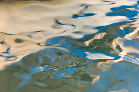 Reflection as a liquid abstraction painted by the sea, sun and wind somewhere in Greece