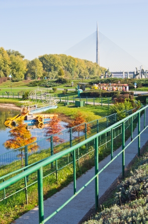Ada lake at sunny morning, tourist trane and a cable bridge , Belgrade, Serbiaの写真素材