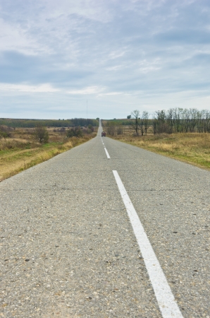 Straight road at cloudy autumn day before the rain, north Serbiaの写真素材