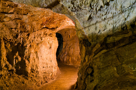 Adventure through illuminated maze of underground cave corridors, Homolje mountains, east Serbiaの写真素材