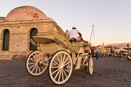 Horse carriage in Chania harbor at sunset, Crete, Greeceの写真素材
