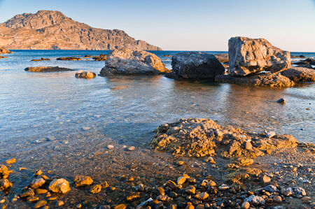 Sea rocks at sunset, south coast of Crete island, Greeceの写真素材