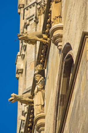 Monks and gargoyles, detail from the exterior of saint Stephen s catedral at downtown of Vienna, Austriaの写真素材